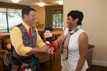 Dale Obrochta interacting with an employee during a company event in Chicago