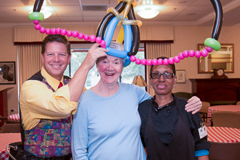 Dale Obrochta creating a fun balloon moment with employees at a company event in Chicago