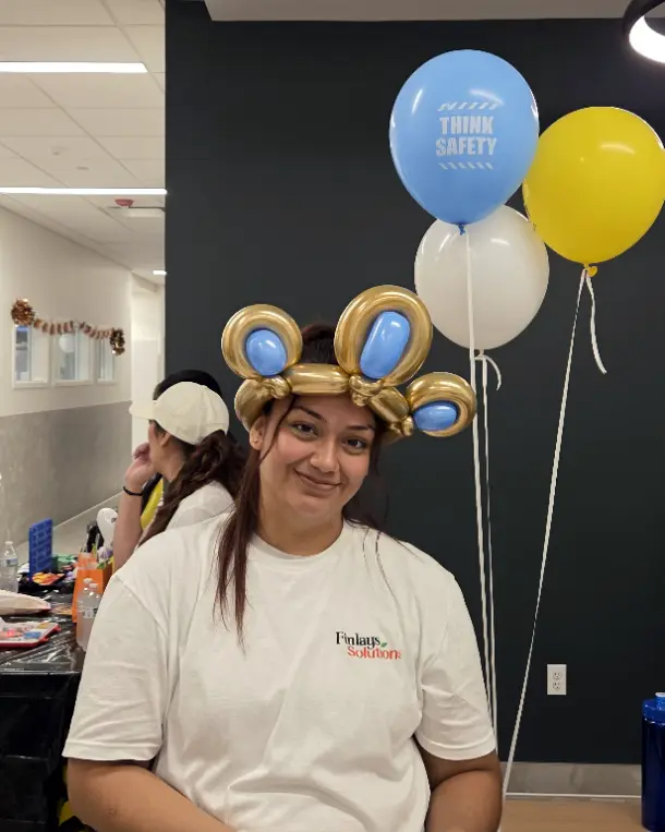 NLX Beverage Solutions employee wearing a balloon hat during the Safety Week employee picnic in New Lenox