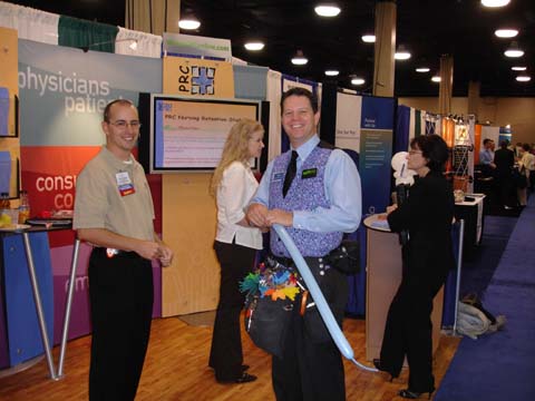 Dale Obrochta engaging attendees while working inside a corporate trade show booth